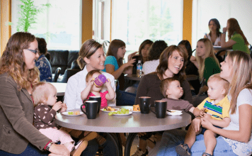 women around table at moms group