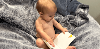 toddler reading a book