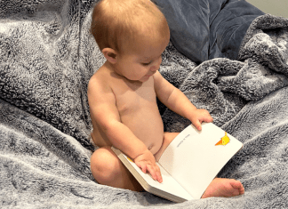 toddler reading a book