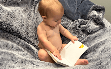 toddler reading a book