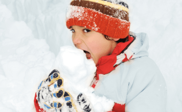 kid eating snow