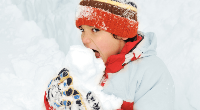 kid eating snow