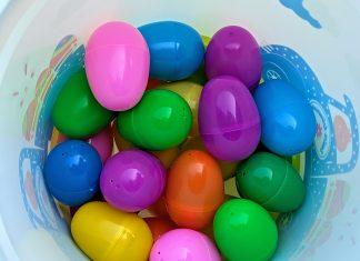 multicolored plastic eggs in a bucket